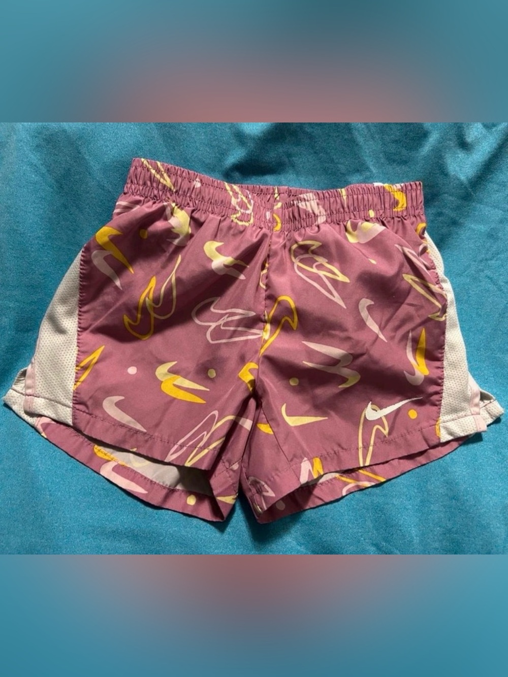 Nike Mauve-Pink Athletic Shorts with Yellow & White Swoosh Print